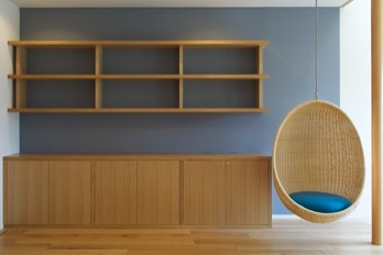  Bookshelves and storage furniture with hanging chair. 