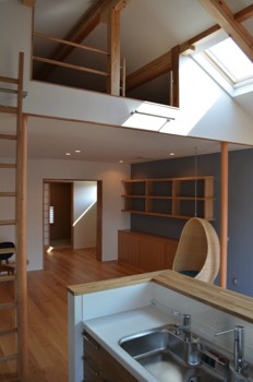  View of the living room from the kitchen with Japanese room doors opened. 