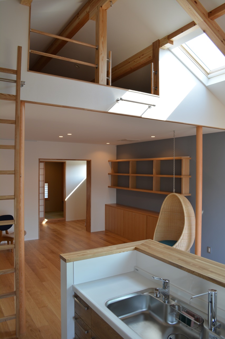  View of the living room from the kitchen with Japanese room doors opened. 